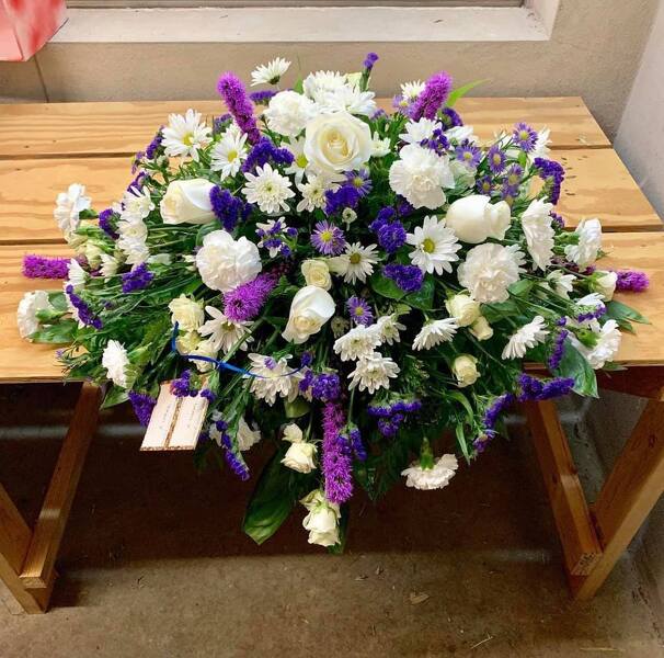 Sympathy In Purple Blooms from Rogers Florist, your flower shop in Meridian, MS